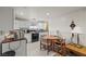Eat in kitchen with white cabinetry, microwave, and table with chairs at 1160 Huracan St, Pahrump, NV 89048