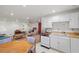Kitchen and living room area with adjacent seating and furnishings at 1160 Huracan St, Pahrump, NV 89048