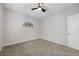 Bedroom featuring carpet flooring, a decorative wall piece, a window, and a ceiling fan at 1609 Dream Canyon Ave, North Las Vegas, NV 89084