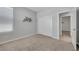 Bedroom featuring carpeted floors, a closet with sliding doors, and a window, offering comfortable living space at 1609 Dream Canyon Ave, North Las Vegas, NV 89084
