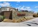 Beautiful Blackstone community entrance with stone walls, landscaping, and clear signage for a welcoming aesthetic at 1609 Dream Canyon Ave, North Las Vegas, NV 89084