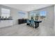 Contemporary dining area with stylish chairs, modern light fixture, and lots of natural light at 1609 Dream Canyon Ave, North Las Vegas, NV 89084