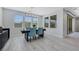 Contemporary dining area with stylish chairs, modern light fixture, and lots of natural light at 1609 Dream Canyon Ave, North Las Vegas, NV 89084