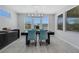 Contemporary dining area with stylish chairs, modern light fixture, and lots of natural light at 1609 Dream Canyon Ave, North Las Vegas, NV 89084