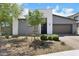 Beautiful single-story home with modern gray stucco exterior and a low-maintenance desert landscape at 1609 Dream Canyon Ave, North Las Vegas, NV 89084