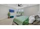 Comfortable main bedroom featuring plush carpet, fan, and lots of natural light at 1609 Dream Canyon Ave, North Las Vegas, NV 89084