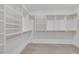 Spacious walk-in closet with custom shelving and rods for ample storage and organization at 1609 Dream Canyon Ave, North Las Vegas, NV 89084