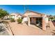 View of backyard featuring desert landscaping, patio and mature trees for extra privacy at 2037 Poppywood Ave, Henderson, NV 89012