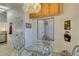 Cozy breakfast nook with glass table next to the sliding patio door at 2037 Poppywood Ave, Henderson, NV 89012