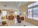Dining area with hardwood floors, a chandelier, and sliding doors leading to the outdoor space at 2037 Poppywood Ave, Henderson, NV 89012