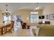 Bright living room featuring hardwood floors, a ceiling fan, and sliding glass doors to the patio at 2037 Poppywood Ave, Henderson, NV 89012