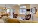 Inviting living room with hardwood floors, a ceiling fan, and sliding doors leading to the outdoor area at 2037 Poppywood Ave, Henderson, NV 89012