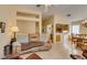 Spacious living room with view of kitchen area, featuring hardwood floors and comfortable seating at 2037 Poppywood Ave, Henderson, NV 89012