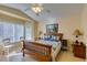 Tranquil primary bedroom with large windows, vaulted ceilings, and a queen bed at 2037 Poppywood Ave, Henderson, NV 89012