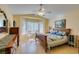 Serene bedroom with vaulted ceilings, large windows and a comfortable queen bed at 2037 Poppywood Ave, Henderson, NV 89012