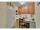 Small office with lots of storage, desk and chair near a door at 2037 Poppywood Ave, Henderson, NV 89012