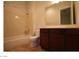 Well-lit bathroom with a vanity and a shower/tub combination at 2324 Orangeburg Pl, Henderson, NV 89044