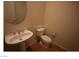 Powder room featuring pedestal sink, toilet, and tile flooring at 2324 Orangeburg Pl, Henderson, NV 89044