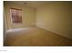 Carpeted bedroom featuring a window with blinds at 2324 Orangeburg Pl, Henderson, NV 89044