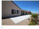 Exterior view of the home's backyard, patio, and landscaping at 2324 Orangeburg Pl, Henderson, NV 89044