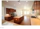 Modern kitchen featuring stainless steel appliances, an island, and wood cabinets at 2324 Orangeburg Pl, Henderson, NV 89044