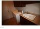 Functional laundry room with sink and storage cabinets at 2324 Orangeburg Pl, Henderson, NV 89044