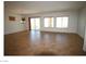 Large living room with tile floors, recessed lighting, and multiple windows and sliding glass door at 2324 Orangeburg Pl, Henderson, NV 89044