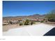 A covered patio with concrete floor and neighborhood and mountain views at 2324 Orangeburg Pl, Henderson, NV 89044