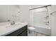 Clean bathroom featuring a shower over tub, vanity, and modern fixtures at 243 Sun Glaze Ave, Henderson, NV 89011