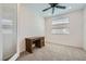 Bedroom with light-colored carpet, a ceiling fan, a wooden desk, and two windows at 243 Sun Glaze Ave, Henderson, NV 89011