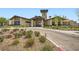 Stunning clubhouse entrance with stone accents, manicured landscaping and paved driveway at 243 Sun Glaze Ave, Henderson, NV 89011