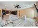 Open concept living room showcasing wood floors, recessed lighting, neutral colored walls, and open kitchen access at 243 Sun Glaze Ave, Henderson, NV 89011