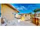 Balcony featuring stone balustrade, two chairs, and a view of the community at 25 Luce Del Sole # 3, Henderson, NV 89011