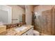 Bathroom featuring a large vanity, granite countertops and a glass-enclosed shower at 25 Luce Del Sole # 3, Henderson, NV 89011