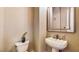 Small bathroom featuring a pedestal sink, toilet and simple decor at 25 Luce Del Sole # 3, Henderson, NV 89011
