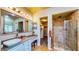 Beautiful bathroom boasts a large vanity with vessel sink and separate glass shower with tile surround at 25 Luce Del Sole # 3, Henderson, NV 89011
