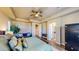 Open and airy primary bedroom featuring tray ceilings and wood-style flooring at 25 Luce Del Sole # 3, Henderson, NV 89011
