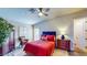 Cozy bedroom with a ceiling fan, a comfortable queen bed and wood-look flooring at 25 Luce Del Sole # 3, Henderson, NV 89011