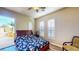 Bedroom with shuttered windows, ceiling fan, and access to outdoor space at 25 Luce Del Sole # 3, Henderson, NV 89011