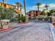 Gated community entrance with manicured landscaping, secure access, and well-maintained paved roads at 25 Luce Del Sole # 3, Henderson, NV 89011