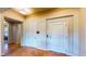 Hallway featuring tile flooring, access to the elevator, a door, and an entryway into another room at 25 Luce Del Sole # 3, Henderson, NV 89011