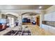 Open kitchen with granite countertops and island, seamlessly connecting to the living spaces at 25 Luce Del Sole # 3, Henderson, NV 89011