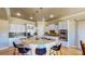 Spacious kitchen with granite countertops, stainless steel appliances, and custom white cabinetry at 25 Luce Del Sole # 3, Henderson, NV 89011