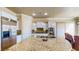 Bright kitchen with granite countertops, stainless steel appliances, and eat-in dining area at 25 Luce Del Sole # 3, Henderson, NV 89011