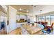 Bright kitchen featuring a large center island with granite countertops and stainless steel appliances at 25 Luce Del Sole # 3, Henderson, NV 89011