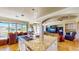 Gourmet kitchen with island, granite countertops, dining area, and open floor plan at 25 Luce Del Sole # 3, Henderson, NV 89011