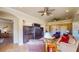 Spacious living room with tiled flooring, ceiling fans, comfortable seating, and built in cabinets at 25 Luce Del Sole # 3, Henderson, NV 89011