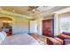 Spacious main bedroom boasts ample natural light, a seating area, and a large wardrobe at 25 Luce Del Sole # 3, Henderson, NV 89011