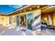 Covered outdoor patio with sliding glass doors and seating offers a relaxing space for outdoor living at 25 Luce Del Sole # 3, Henderson, NV 89011