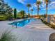 Stunning community pool with palm trees and desert landscaping at 25 Luce Del Sole # 3, Henderson, NV 89011
